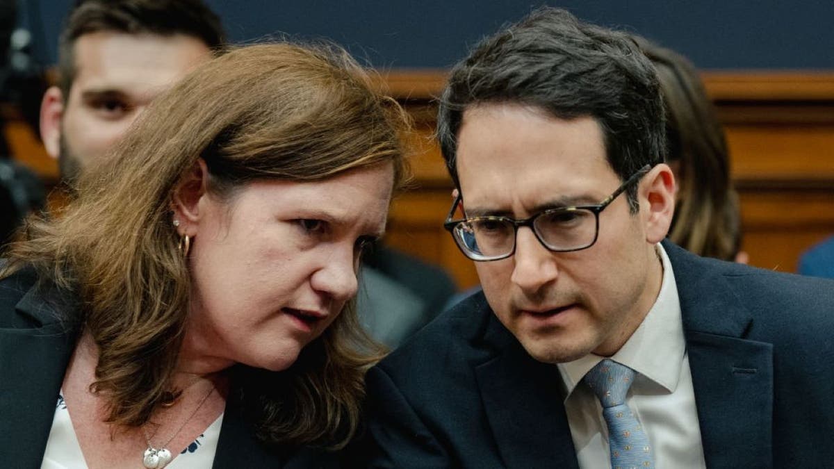 WASHINGTON, DC - JULY 13: Federal Trade Commission Commissioners Rebecca Kelly Slaughter (L) chats with Alvaro Bedoya (R) before FTC Chair Lina Khan testifies during a House Judiciary Committee hearing in the Rayburn House Office Building on Capitol Hill in Washington, DC on July 13, 2023. (Photo by Shuran Huang for The Washington Post via Getty Images)