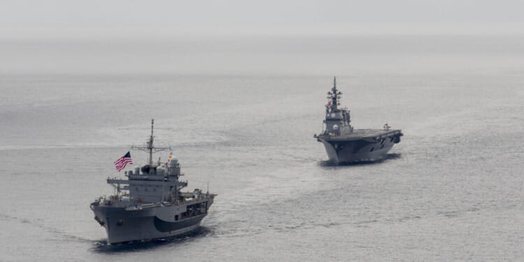 The Japan Maritime Self-Defense Force Hyuga-class helicopter destroyer JS Hyuga (DDH 181) sails in formation with U.S. 7th Fleet flagship USS Blue Ridge (LCC 19) in support of Exercise Freedom Edge 25 in the U.S. 7th Fleet area of operations, Sept. 16, 2025.