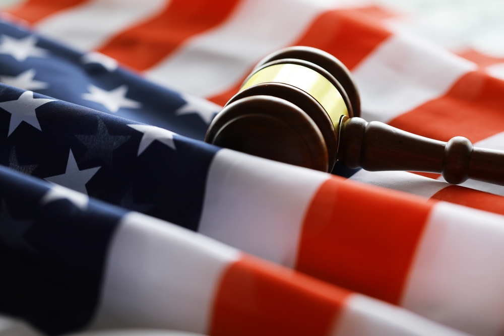 Gavel on american flag, representing US legislation and the SPEED Act