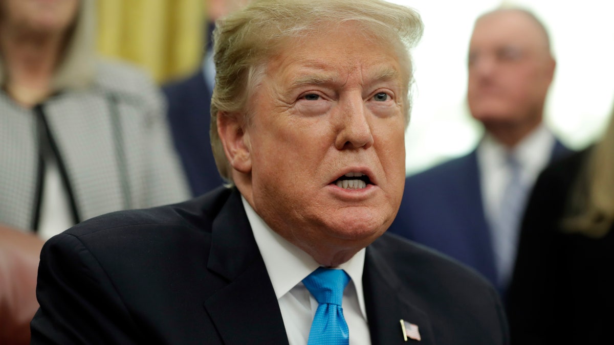 President Donald Trump speaks during a signing ceremony for "Space Policy Directive 4" in the Oval Office of the White House in Washington in 2019.