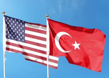 American flag and Turkish flag on cloudy sky. nuclear energy partnership