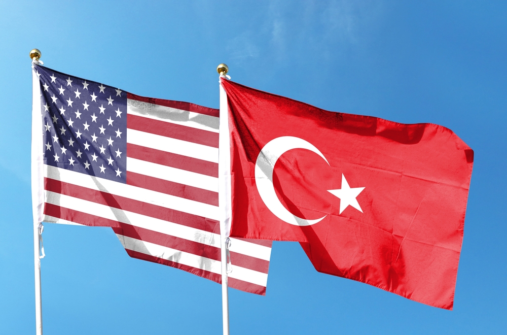 American flag and Turkish flag on cloudy sky. nuclear energy partnership