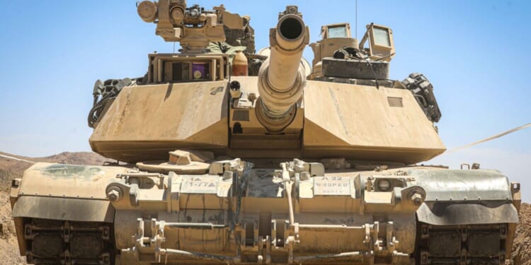 U.S. Soldiers assigned to 1st Battalion, 77th Armored Regiment, 3rd Armored Brigade Combat Team, 1st Armored Division postured an M1 Abrams Main Battle Tank in a fighting position during Rotation 24-08 at the National Training Center, Fort Irwin, Calif., June 13, 2024.