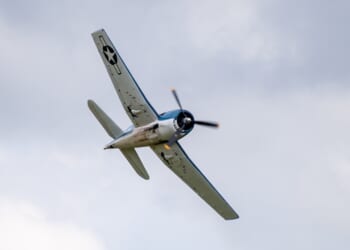 A Grumman F6F Hellcat flying overhead.