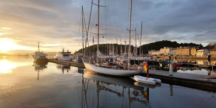 A British sailing ship at dock.