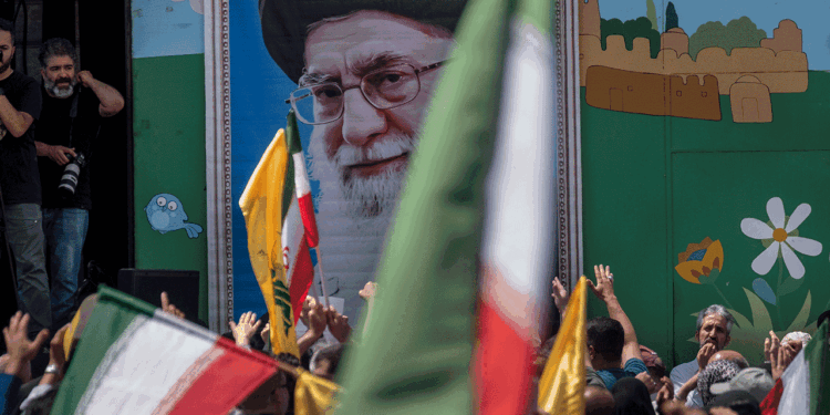 Supreme Leader Ayatollah Ali Khamenei image on the wall during a pro-Iran demonstration