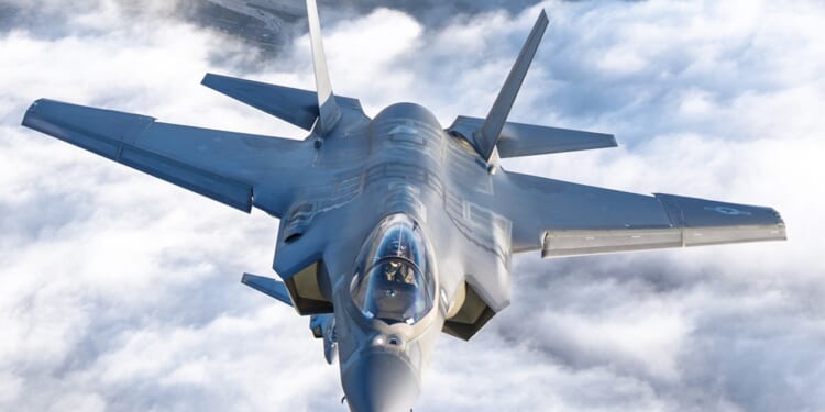 An F-35 over clouds.