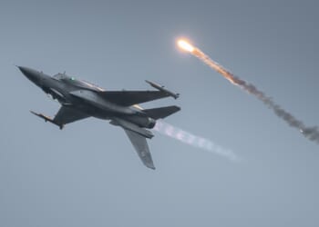 An F-16 flying upside down.