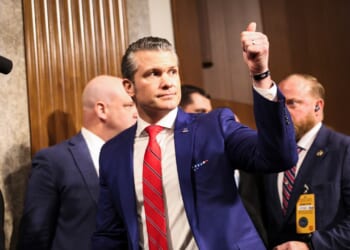 Secretary of Defense Pete Hegseth giving a thumbs-up.
