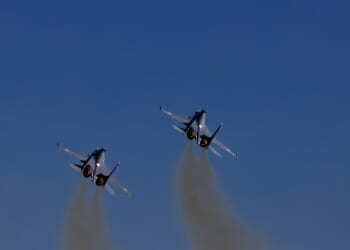 Two Russian fighter jets in flight.