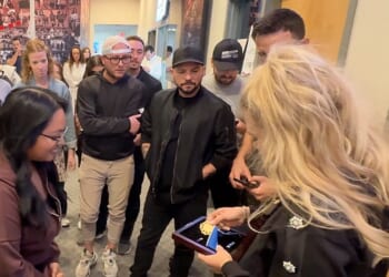 Erika Kirk shows Charlie Kirk's Medal of Freedom to Turning Point staff