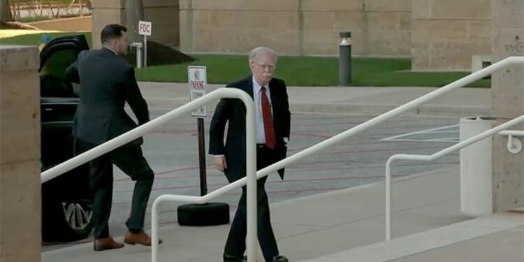 John Bolton surrenders to face charges of sharing classified information
