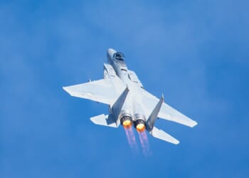 An F-15 Eagle ascending in the sky.