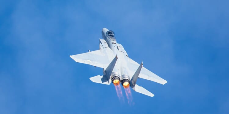 An F-15 Eagle ascending in the sky.