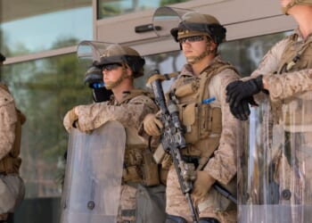 US marines stand guard at protests in LA.
