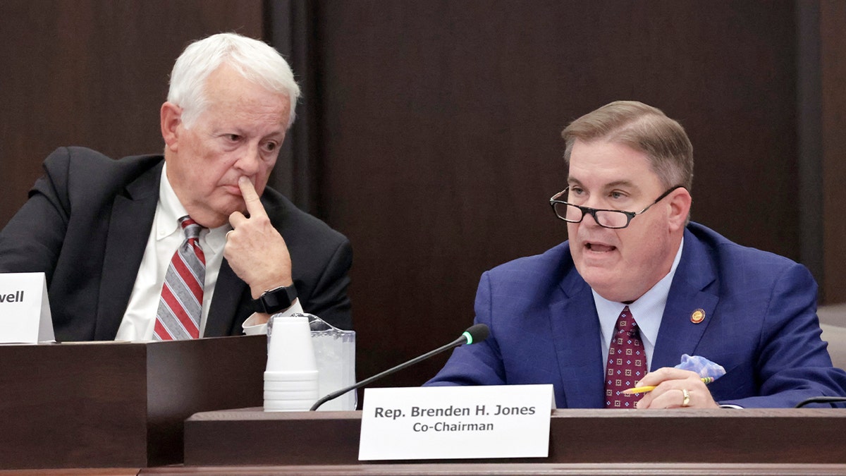 Rep. Hugh Blackwell and Rep. Brenden Jones speaking during committee meeting