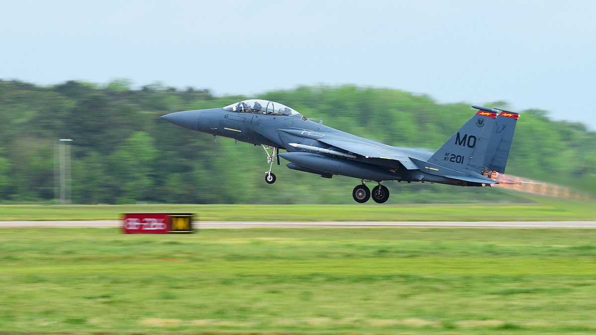 fighter jet takes off at air force base