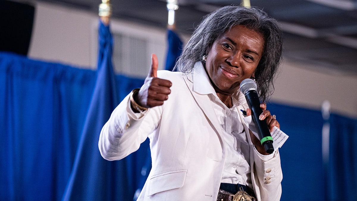 Winsome Earle-Sears gives audience a thumbs up at campaign event