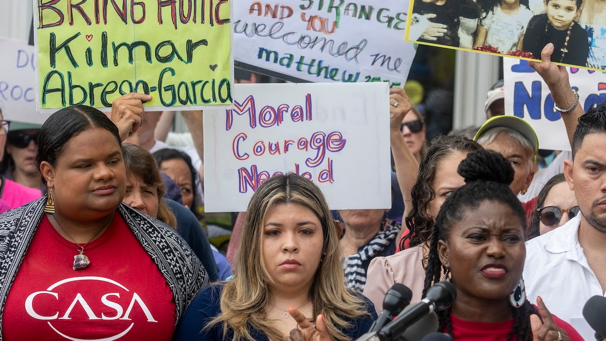 The wife of Kilmar Abrego Garcia, Jennifer Vasquez Sura, stands with demonstrators as they rally in support of Garcia outside federal court during a hearing in Greenbelt, Maryland. (Jim Watson/AFP via Getty)