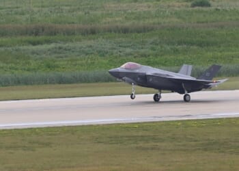 An F-35 landing on a runway.