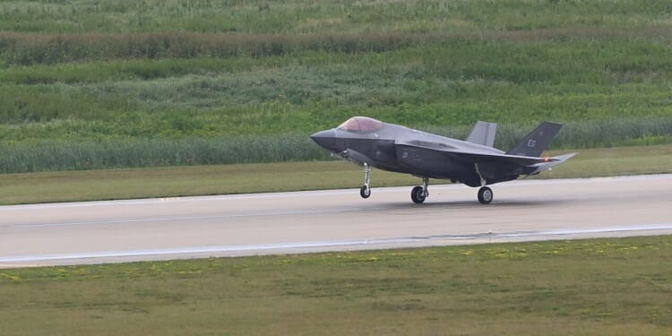 An F-35 landing on a runway.
