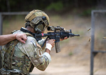 A U.S. Air Force Staff Sgt. Lawrence Durr, assigned to the 186th Security Forces Squadron, shoots an M4 carbine during exercise Sage Eagle 25-4 at Fort A.P. Hill, Virginia, August 21, 2025.
