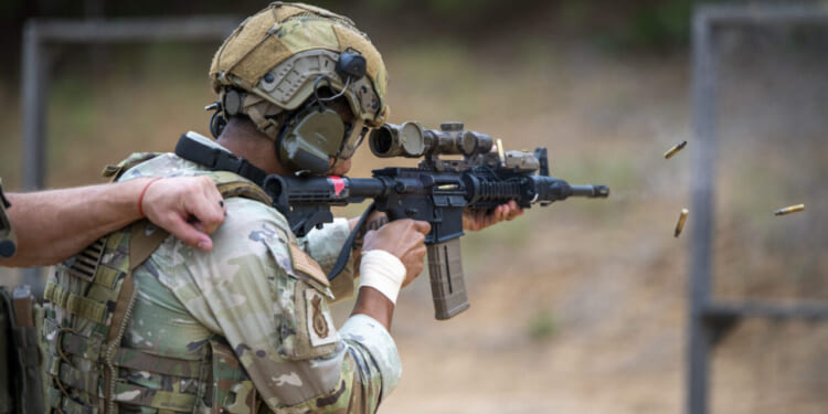 A U.S. Air Force Staff Sgt. Lawrence Durr, assigned to the 186th Security Forces Squadron, shoots an M4 carbine during exercise Sage Eagle 25-4 at Fort A.P. Hill, Virginia, August 21, 2025.