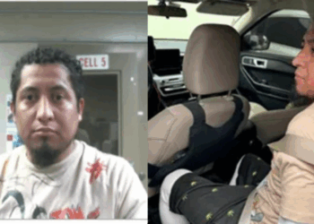 Mugshot and police vehicle image of a male subject in custody, showcasing a serious expression and seated position with seatbelt fastened.