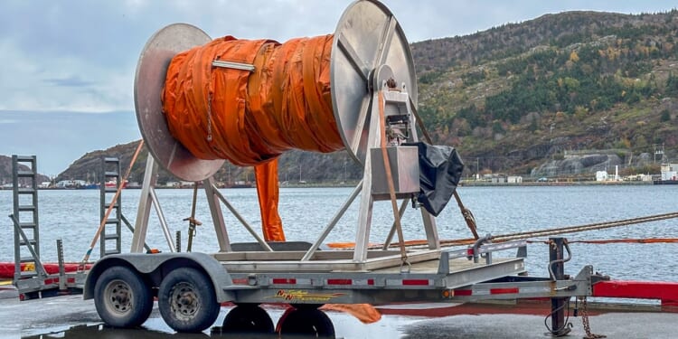 An undersea cable being laid.