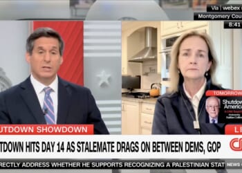 CNN hosts discuss the ongoing government shutdown on a live broadcast, highlighting the 14th day of the stalemate between Democrats and Republicans.