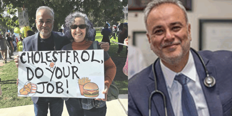 Two people hold a sign reading "Cholesterol, Do Your Job!" at a health awareness event, emphasizing the importance of managing cholesterol levels.