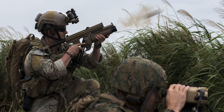 A soldier firing a grenade launcher.