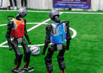 Chongqing, China - Sep, 5th 2025: humanroid robots play foot game during Smart China Expo.The robot is from chinese leading robot company Unitree.