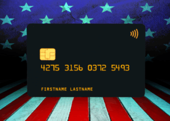 Credit card displayed against a backdrop of American flags and stripes, emphasizing financial services and payment options.