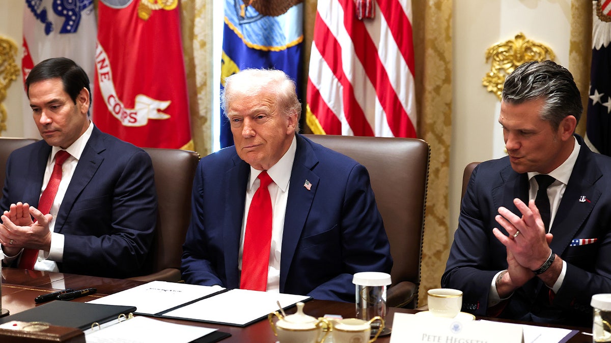 Trump looks on during a Cabinet meeting