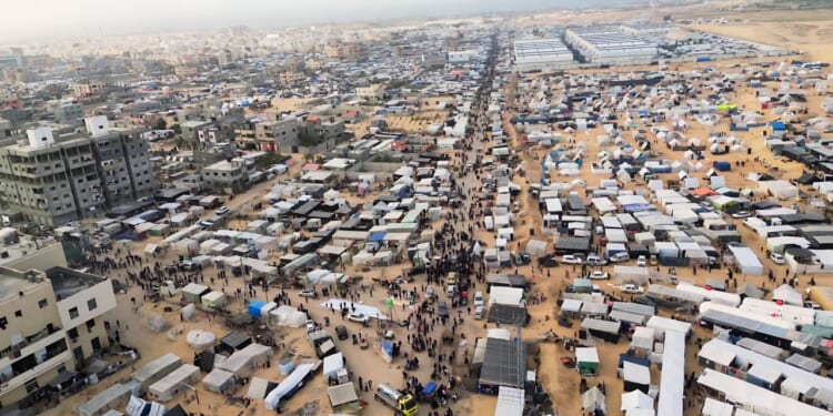 Refugees gather in Gaza City.