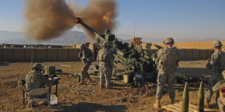 An M777 howitzer firing.