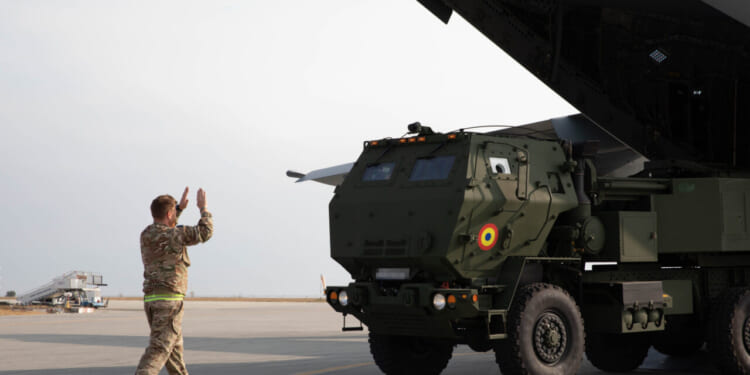 Personnel from the Romanian Land Forces 8th Tactical Operational Missile Brigade and the U.K. Royal Air Force practice loading and unloading the High Mobility Artillery Rocket System (HIMARS) on a U.K. A400M during a dry-fire exercise as part of the ATREUS exercise series on Nov. 8, 2022, at Mihail Kogălniceanu Airbase, Romania.