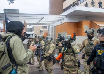 A group of soldiers near a protest in Portland, Oregon.