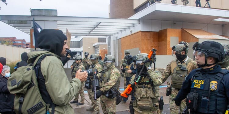 A group of soldiers near a protest in Portland, Oregon.