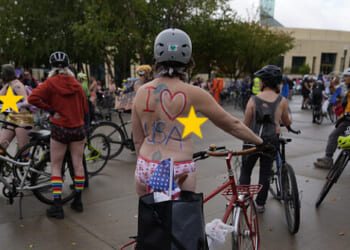Hundreds of Naked Bike Riders Join Anti-ICE Protest