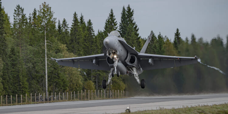 A Finnish Air Force F/A-18 Fighter Jet taxis out during the Exercise BAANA 2024, on Hosio Highway, Ranua, Finland, Sept. 04.