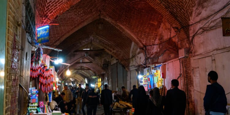 People walk through marketplace in Tabriz, Iran.