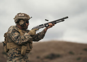 U.S. Marine Corps Lance Cpl. Albert Aguilera, a student with the Small Unmanned Aircraft System Integration Course, 1st Marine Division Schools, fires a Benelli M4 semi-automatic shotgun during a SUAS integration field exercise on Marine Corps Base Camp Pendleton, California, Jan. 30, 2024.