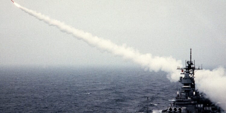 A US Navy ship firing a Tomahawk missile.