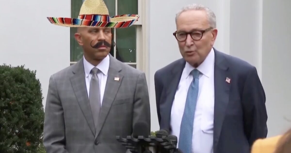 Two men stand at a podium outside the White House, one wearing a sombrero and the other speaking, highlighting a press event.
