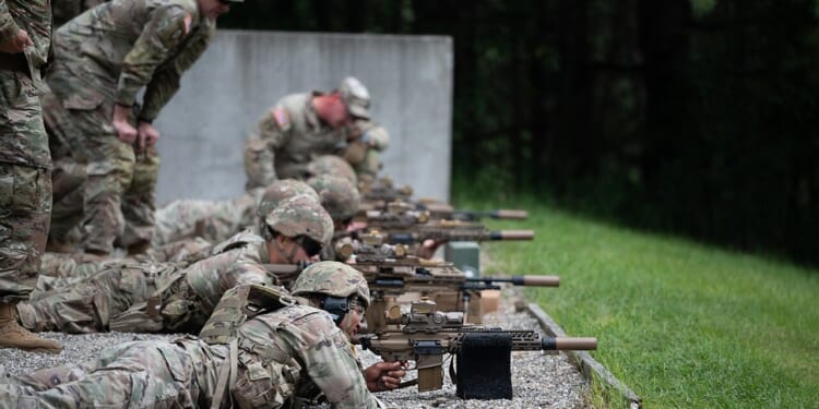 A group of soldiers firing the M250 machine gun.