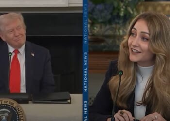 Donald Trump and a woman speaking during a discussion at a presidential event, both engaged and smiling, emphasizing a collaborative atmosphere.