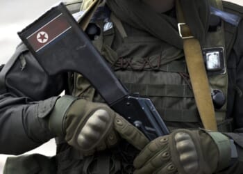 Flag of North Korea on assault rifle butt.