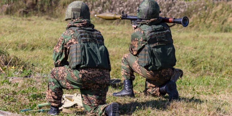A soldier shoots an RPG-7.